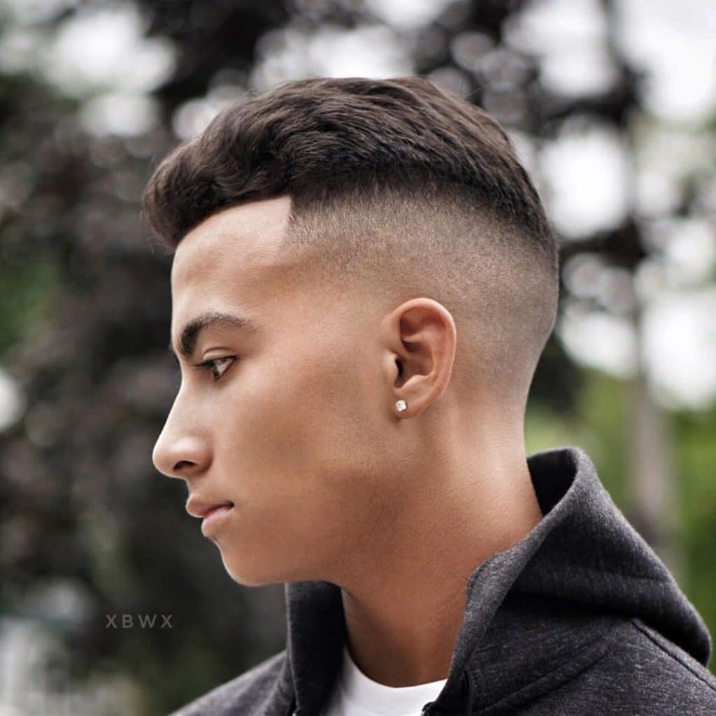 The Slicked-Back Hair with Low Taper Fade